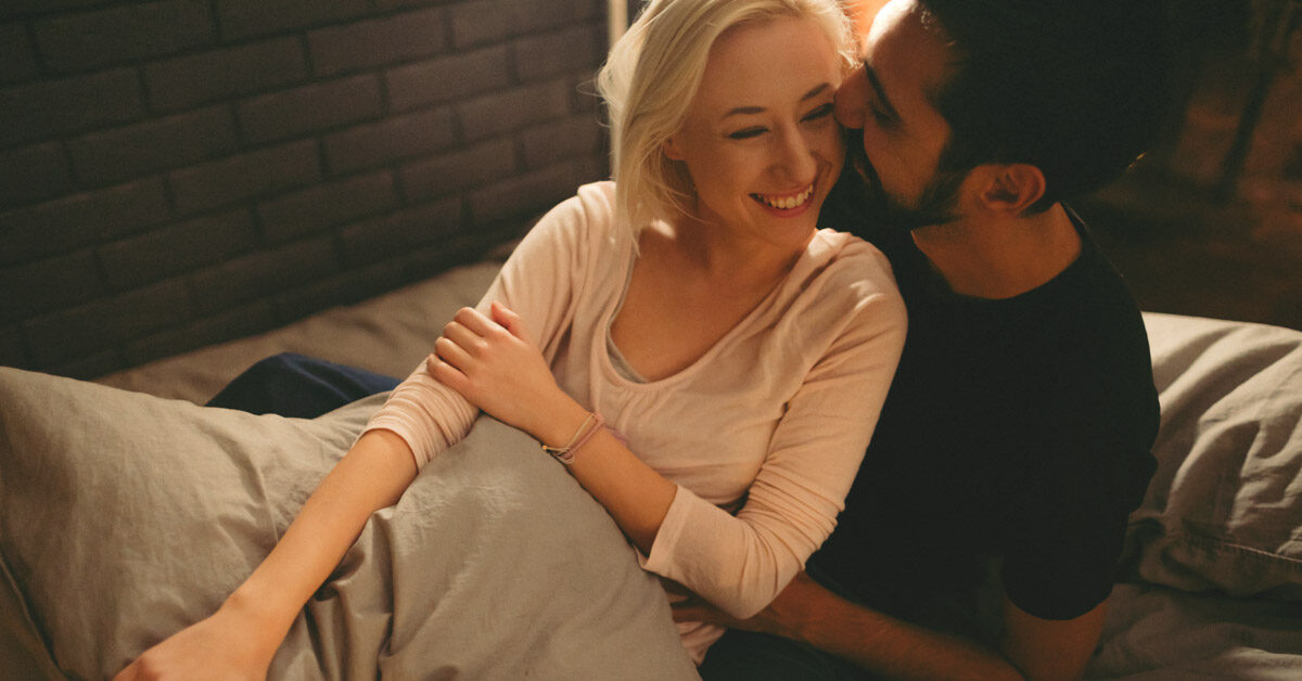 5848-couple_bed_cuddling-1200x628-facebook-1200x628