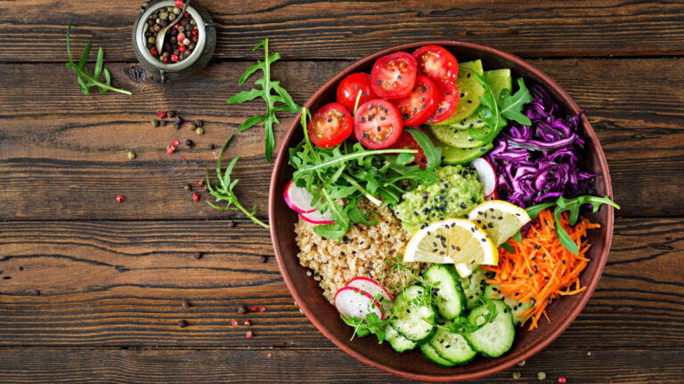 Vegetarian Buddha bowl with quinoa and fresh vegetables. Healthy food concept. Vegan salad. Top view. Flat lay
